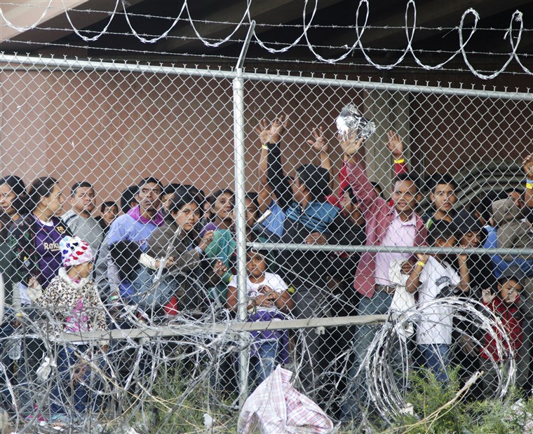 Caged Latino migrants at the US Border